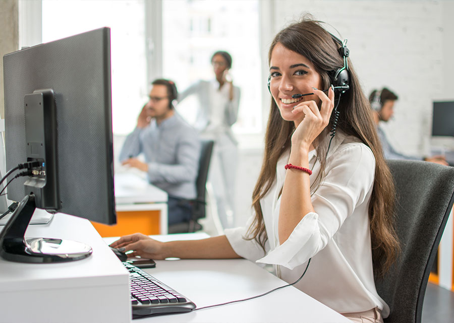 woman answers phones in a call center