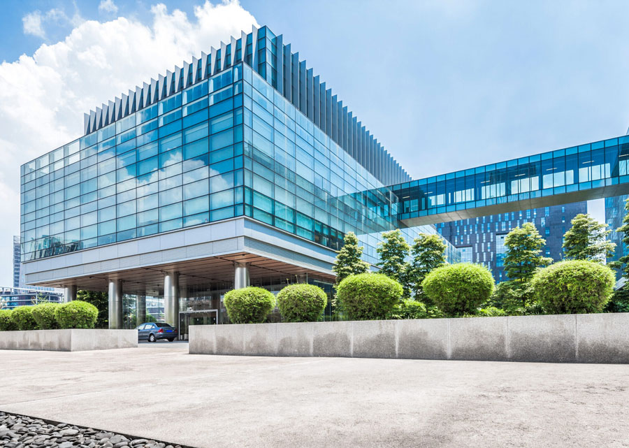 mostly glass exterior of a commercial building