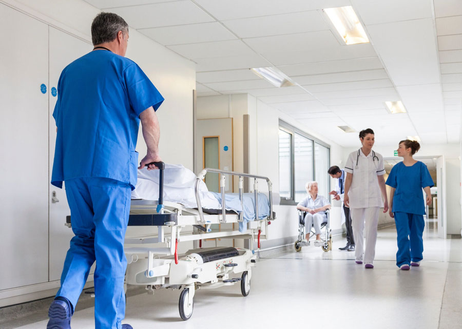 busy hospital hallway with nurses and doctors